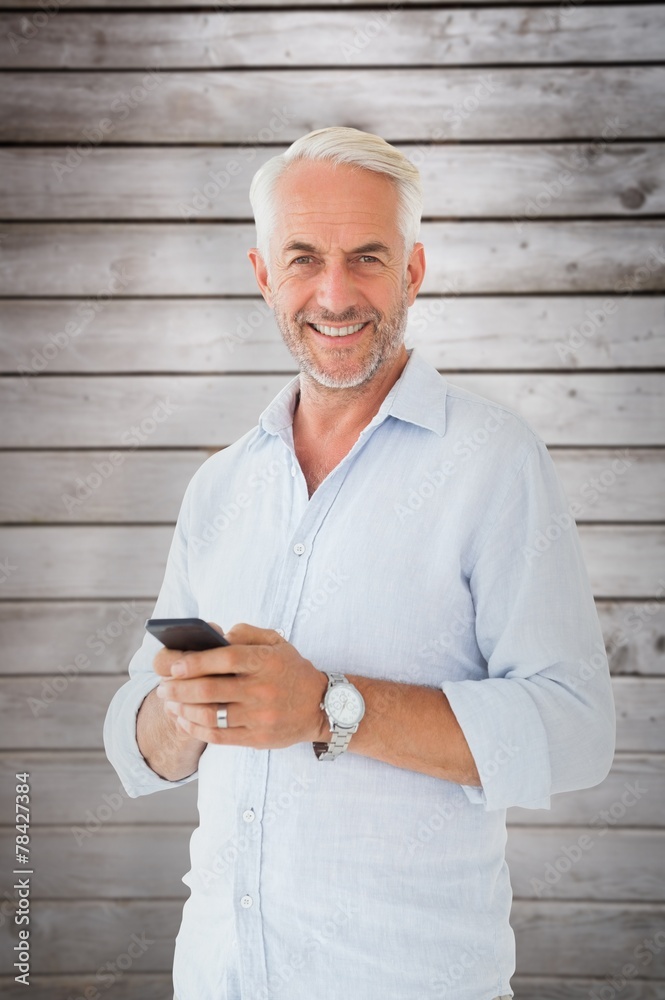Poster Composite image of smiling man sending a text message