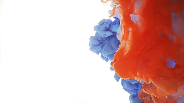 blue and orange color drop circulating, forming a color spread.