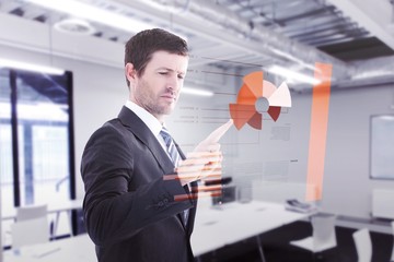 Composite image of businessman standing and pointing the finger