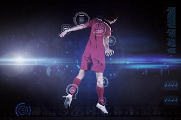 Obraz premium Composite image of fit football player jumping up