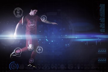 Composite image of football player in red kicking