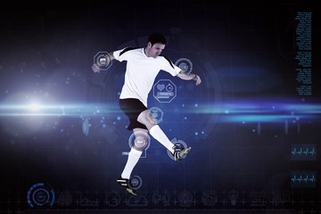 Composite image of football player in white kicking