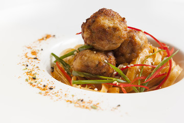 fried meatballs with noodles