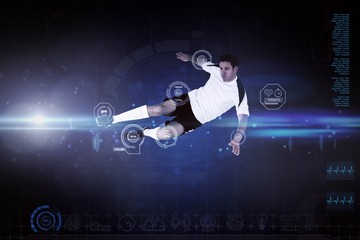Composite image of football player in white kicking