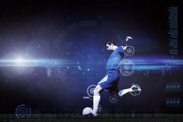Fototapeta na wymiar Composite image of football player kicking ball