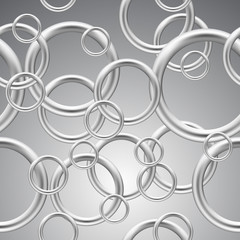 Seamless background of metal rings.