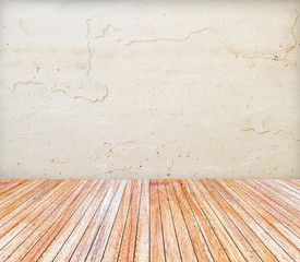 Backdrop sandstone wall and wood slabs arranged in perspective.