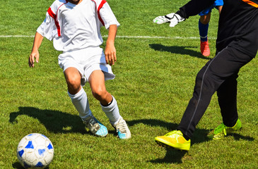 Kids are playing soccer