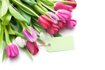 Bouquet of tulips with an empty tag isolated on white background