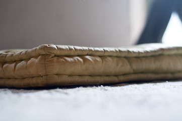 Old Woolen Bed in the ground is close-up shoot