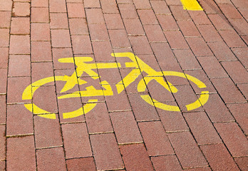 Bicycle sign on the paving stones of the bicycle road © majorosl66