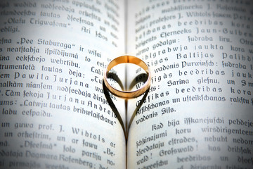 wedding ring on vintage book