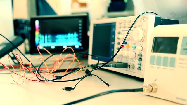 electronic components and oscilloscope in laboratory