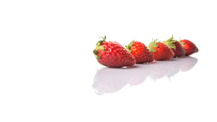 Strawberries over white background