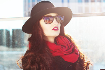 elegant woman in a hat with red lips