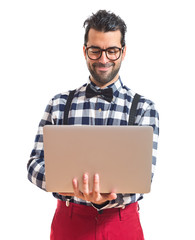 Posh boy with laptop over white background