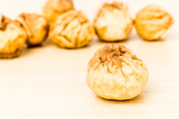 Close up and selective focus on the dried figs at the foreground