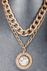 Fototapeta na wymiar vintage fashion antique colorful jewelry necklace on black manne