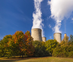 Cooling towers spew clouds into the atmosphere