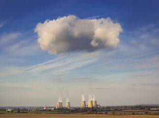 Cooling towers spew clouds into the atmosphere