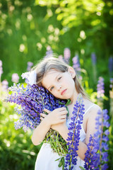 beautiful girl with lupines