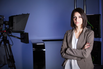 Recording at TV studio with television anchorwoman. TV NEWS