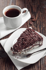 Piece of chocolate cake and coffee cup