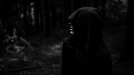 Grim reaper demon in search of victim. Death coming for soul