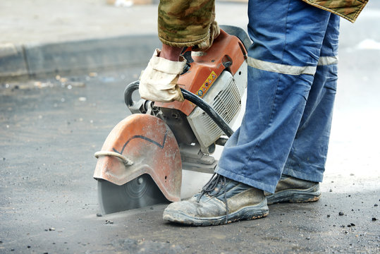 construction worker with cut-off machine