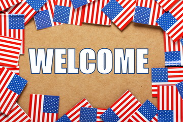 Fototapeta na wymiar The word Welcome with a border of USA Flags