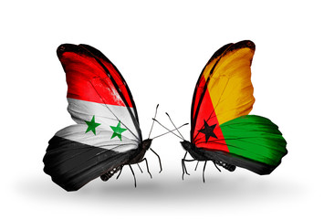 Two butterflies with flags Syria and Guinea Bissau