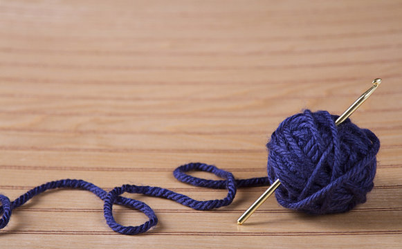 Ball of yarn with crochet needle