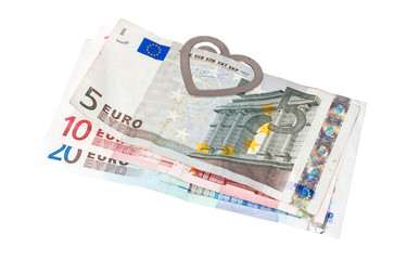 Obraz na płótnie Canvas Eurobanknotes with a paper clip in the form of heart