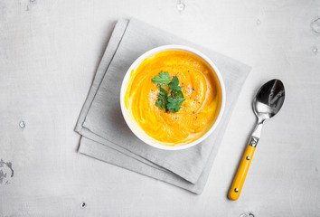 Pumpkin soup with parsley background