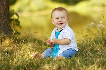 little boy playing in nature
