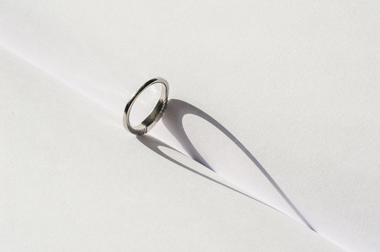 Ring with Heart Shaped Shadow on a book