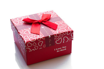 Red box wrapping ribbon bow isolated on white