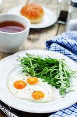 fresh breakfast with scrambled eggs and arugula