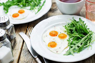 fresh breakfast with scrambled eggs and arugula