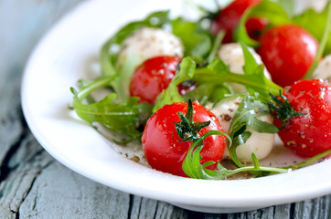 Salad with mozzarella and tomatos