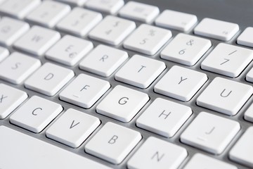 Close up of a computer keyboard with white keys