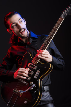 Man with guitar during concert