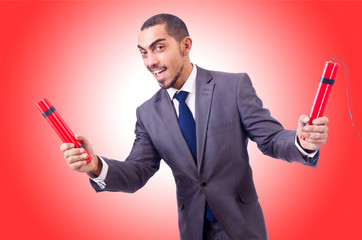 Businessman with dynamite isolated on white
