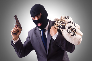 Gangster with bags of money on white