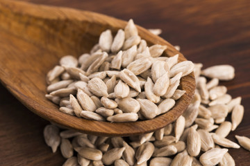 Sunflower seed with a wooden spoon