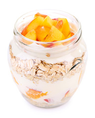 Healthy breakfast - yogurt with  fresh peach and muesli served