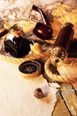 Marine still life spyglass and world map