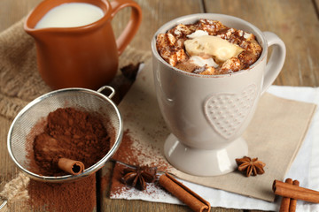 Cup of hot coffee with marshmallow and cup of milk with
