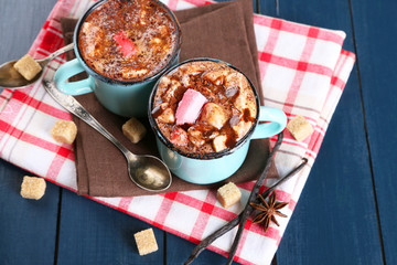 Mugs of hot coffee with marshmallow