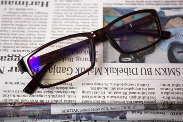 glasses and newspaper